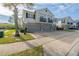 Shot of the home's exterior including the driveway, sidewalk, and small landscaped yard at 6612 S Goldenrod Rd # 104A, Orlando, FL 32822