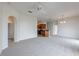Bright and airy living room leading into the kitchen with arched doorway and neutral color scheme at 6612 S Goldenrod Rd # 104A, Orlando, FL 32822