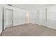 Spacious bedroom with neutral carpet, white walls, and ensuite bathroom access at 8007 Colby Cir, Orlando, FL 32817