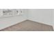 Neutral bedroom with plush carpet, white walls, and natural light at 8007 Colby Cir, Orlando, FL 32817