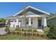 Charming single-story home featuring a neatly landscaped front yard, two-car garage and covered front porch at 8007 Colby Cir, Orlando, FL 32817