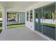Covered patio with sliding glass doors and view to backyard at 8007 Colby Cir, Orlando, FL 32817