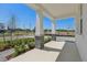 Inviting front porch supported by sturdy columns with stone accents and offering ample space to relax at 8007 Colby Cir, Orlando, FL 32817