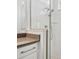 Close up of glass shower with white tile and granite countertop vanity at 8007 Colby Cir, Orlando, FL 32817