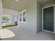 Inviting covered entryway with a modern front door and neutral exterior paint at 8013 Colby Cir, Orlando, FL 32817