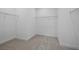 Spacious walk-in closet with neutral carpeting and wire shelving at 8013 Colby Cir, Orlando, FL 32817