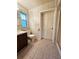 Functional bathroom featuring floral wallpaper, tiled floors, and standard fixtures including a shower at 805 Glen Arden Way, Altamonte Springs, FL 32701