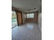 Bright living room with tile floors, sliding glass doors to the pool, and a ceiling fan at 805 Glen Arden Way, Altamonte Springs, FL 32701
