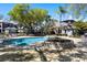 Inviting community pool area with lush landscaping and comfortable lounge seating at 8426 Foxworth Cir # 44, Orlando, FL 32819