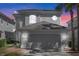 Charming two-story home featuring a tile roof, an attached two car garage, and meticulously maintained landscaping at 8426 Foxworth Cir # 44, Orlando, FL 32819