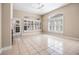 Bright living room with fireplace, tile floors, ceiling fan, and lots of natural light at 8426 Foxworth Cir # 44, Orlando, FL 32819