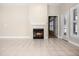 Bright living room with fireplace, tile floors, ceiling fan, and lots of natural light at 8426 Foxworth Cir # 44, Orlando, FL 32819