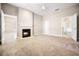 Spacious main bedroom with a fireplace, neutral carpet, and entry to bathroom and hallway at 8426 Foxworth Cir # 44, Orlando, FL 32819