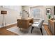 Home office setup featuring a modern desk, stylish chairs, and custom shelving at 8426 Foxworth Cir # 44, Orlando, FL 32819