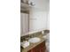 The bathroom offers a granite countertop and a shower with a white curtain at 8763 Worldquest Blvd # 5103, Orlando, FL 32821
