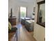 This bedroom features two beds, hardwood floors, and great natural light at 8763 Worldquest Blvd # 5103, Orlando, FL 32821