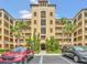 Attractive condo building showcasing a well-maintained exterior with colorful paint and ample parking at 8763 Worldquest Blvd # 5103, Orlando, FL 32821