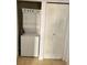 This laundry area includes a stacked washer and dryer unit with closet at 8763 Worldquest Blvd # 5103, Orlando, FL 32821