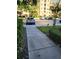 Well-maintained parking lot with ample spaces near attractive condos and lush landscaping at 8763 Worldquest Blvd # 5103, Orlando, FL 32821