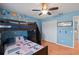 Spacious bedroom with a space-themed design, bunk beds, closet, and laminate floors at 907 Almond Tree Cir, Orlando, FL 32835