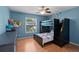 Bedroom with a space-themed design, bunk beds, a ceiling fan, and laminate floors at 907 Almond Tree Cir, Orlando, FL 32835