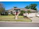 Charming single-story home with brick accents, mature landscaping, and a well-manicured lawn at 907 Almond Tree Cir, Orlando, FL 32835