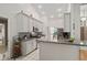 Bright kitchen with granite countertops, stainless steel appliances, and ample cabinet space for storage at 907 Almond Tree Cir, Orlando, FL 32835