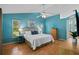Comfortable main bedroom with laminate flooring, a vaulted ceiling, and lots of natural light at 907 Almond Tree Cir, Orlando, FL 32835
