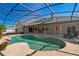 Private screened pool and outdoor living space with chairs in a backyard at 907 Almond Tree Cir, Orlando, FL 32835