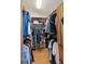 Walk-in closet with plenty of storage for hanging clothes and shoes on shelves at 907 Almond Tree Cir, Orlando, FL 32835