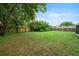 A spacious backyard with lush greenery, perfect for outdoor activities at 908 Cannes Pl, Orlando, FL 32808