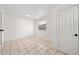 This is a well-lit room with tile flooring and a window with blinds at 908 Cannes Pl, Orlando, FL 32808