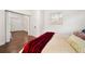 Bedroom featuring a comfortable bed, hardwood floors, and plenty of natural light at 908 Cannes Pl, Orlando, FL 32808