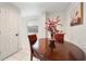 Dining room with a round table, three chairs and a decorative vase at 908 Cannes Pl, Orlando, FL 32808