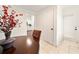 Dining room with table, chairs, vase and a view to the kitchen at 908 Cannes Pl, Orlando, FL 32808