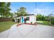 Exterior view of the home showcasing the well-manicured lawn and the front facade at 908 Cannes Pl, Orlando, FL 32808