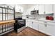 This is a well-equipped kitchen with modern stainless steel appliances and white cabinetry at 908 Cannes Pl, Orlando, FL 32808