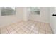 Bright room with tile floors and ample natural light from large windows at 908 Cannes Pl, Orlando, FL 32808