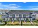 An aerial view of several two-story townhomes with well-maintained landscaping at 9314 Bolshoi Aly, Winter Garden, FL 34787