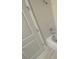 Bathroom featuring a shower head over a tub with a light gray door at 9314 Bolshoi Aly, Winter Garden, FL 34787