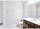 Bathroom featuring a single vanity with wood cabinets and a tile backsplash plus a tile shower at 9314 Bolshoi Aly, Winter Garden, FL 34787