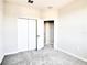 Bedroom featuring plush carpeting, neutral paint, and a large double door closet for ample storage space at 9314 Bolshoi Aly, Winter Garden, FL 34787