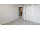 This bedroom includes a closet and an open doorway and a carpeted floor for comfortable and stylish living at 9314 Bolshoi Aly, Winter Garden, FL 34787