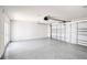 Spacious two-car garage with sealed floors and an automatic door opener system at 9314 Bolshoi Aly, Winter Garden, FL 34787