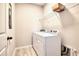 Functional laundry room with washer, dryer, and wire shelving for storage at 9314 Bolshoi Aly, Winter Garden, FL 34787