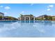 A refreshing pool on a sunny day at a depth of four feet, with chairs nearby at 9314 Bolshoi Aly, Winter Garden, FL 34787