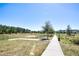 Community walking path winding through lush green space, offering a serene environment at 9314 Bolshoi Aly, Winter Garden, FL 34787