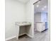 Flex space with counter and view of the kitchen with stainless steel appliances and tile backsplash at 405 Bandon Dunes Loop, Davenport, FL 33837