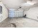 Spacious garage with concrete floor and automatic door opener at 405 Bandon Dunes Loop, Davenport, FL 33837