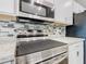 Close up on kitchen appliances and a tiled backsplash at 405 Bandon Dunes Loop, Davenport, FL 33837